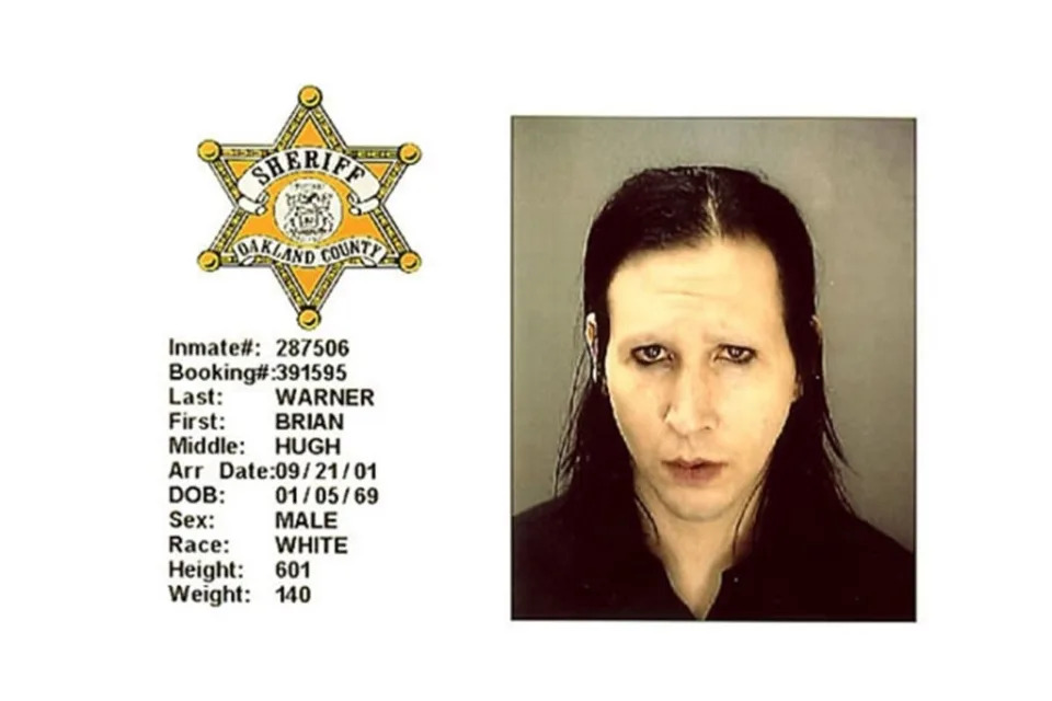 Mugshot of Brian Warner with sheriff's badge and booking details