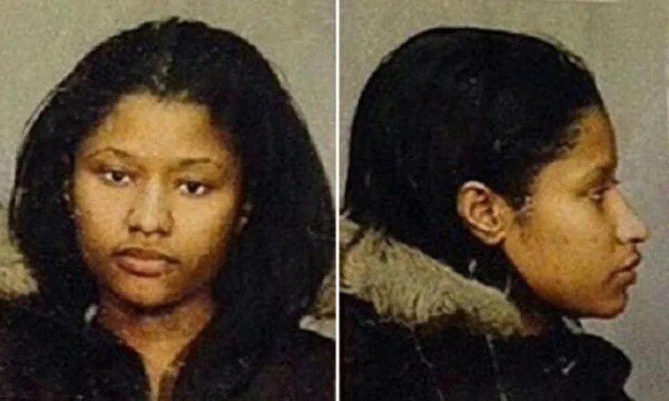 A young Minaj stares at the camera, unhappy